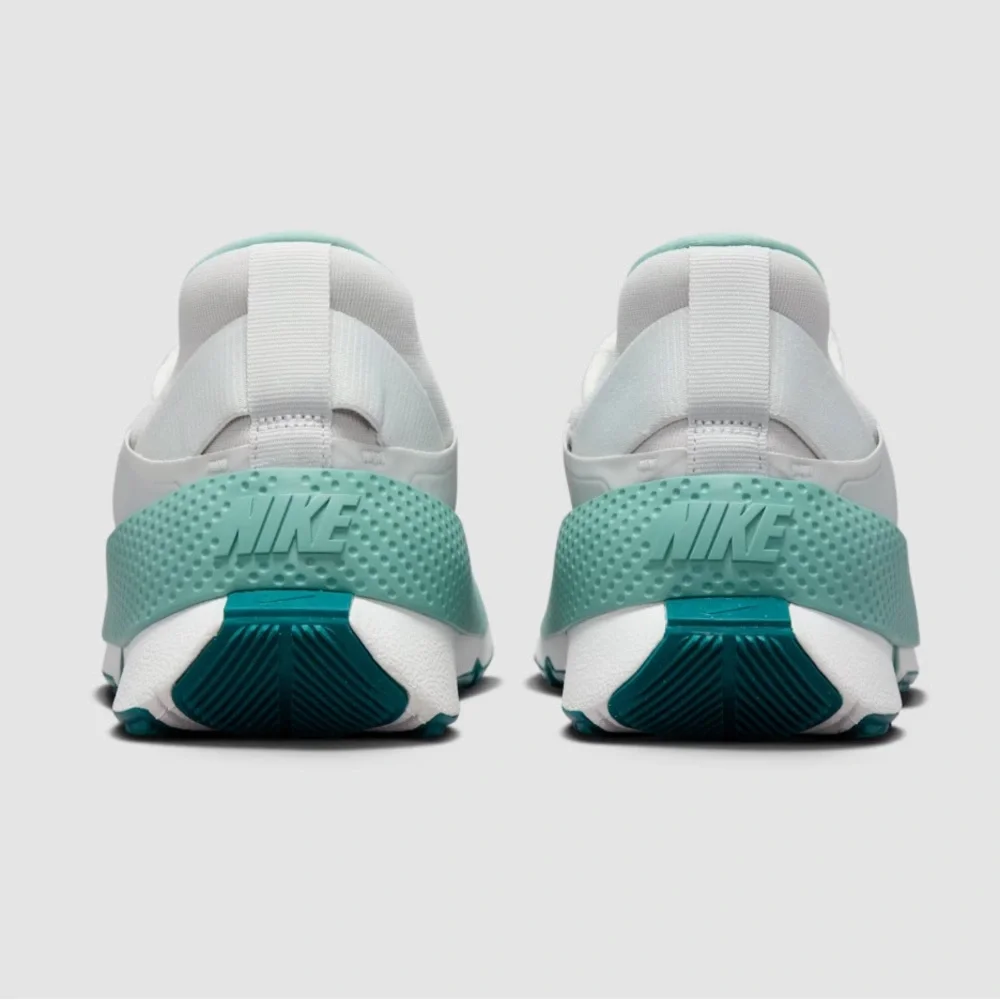 Nike Women’s Slip-On Sneakers in White and Teal